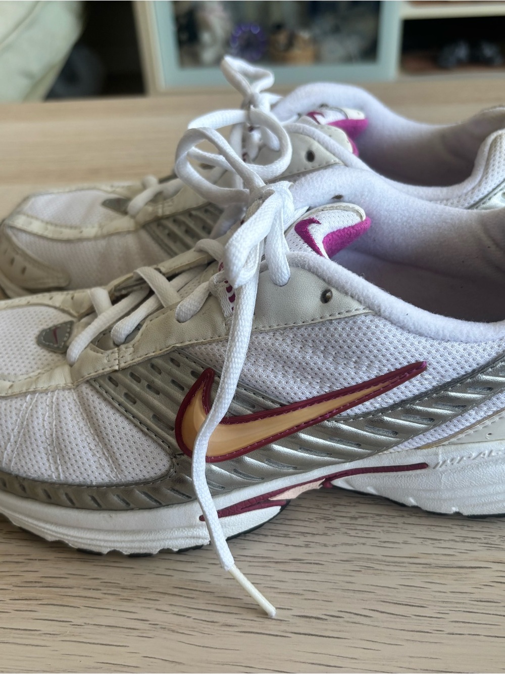 Nike women’s White Running Sneakers with Pink and Gold Swoosh